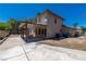 Wide backyard with covered patio, concrete flooring, and stucco walls with a block perimeter fence at 9021 Feather River Ct, Las Vegas, NV 89117