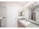Well-lit bathroom featuring granite countertop, a big mirror and shower-tub combination at 9021 Feather River Ct, Las Vegas, NV 89117