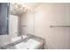 Bathroom features granite countertops, white sink and a large, well-lit mirror at 9021 Feather River Ct, Las Vegas, NV 89117