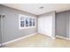 Clean bedroom with shuttered window, wood-look flooring, and closet space at 9021 Feather River Ct, Las Vegas, NV 89117