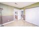 Two-toned bedroom with access to bathroom, closet, and stairwell at 9021 Feather River Ct, Las Vegas, NV 89117