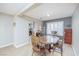 Cozy dining area featuring a wooden table, chairs, and view into the adjacent kitchen at 9021 Feather River Ct, Las Vegas, NV 89117