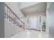 Welcoming entryway with tile floors, front door and staircase to the upper level at 9021 Feather River Ct, Las Vegas, NV 89117