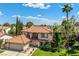 Charming two-story home featuring a tile roof, landscaped yard, and attached two-car garage at 9021 Feather River Ct, Las Vegas, NV 89117