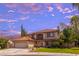 Beautiful two-story home with well-maintained landscaping and a tile roof at 9021 Feather River Ct, Las Vegas, NV 89117