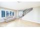 Bright living room with hardwood floors, large windows, and view of the staircase at 9021 Feather River Ct, Las Vegas, NV 89117