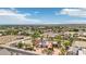 Expansive aerial view of a property with circular driveway, set in an area with mountain views at 9111 W Stephen Ave, Las Vegas, NV 89149