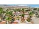 Aerial view showcasing home with pool, mature landscaping, and desert mountain views at 9111 W Stephen Ave, Las Vegas, NV 89149