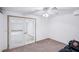 Basement with neutral carpet, recessed lights, and glass doors to another room with a sofa at 9111 W Stephen Ave, Las Vegas, NV 89149