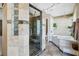 Luxurious bathroom boasting a glass enclosed shower, soaking tub, and contemporary finishes at 9111 W Stephen Ave, Las Vegas, NV 89149