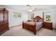 Comfortable bedroom featuring traditional style furnishings, carpeted floors and neutral color walls at 9111 W Stephen Ave, Las Vegas, NV 89149