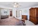 Bedroom boasts a decorative ceiling fan and a large wardrobe with mirrored doors reflecting the room at 9111 W Stephen Ave, Las Vegas, NV 89149