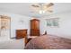 Traditional bedroom with plush bedding, wood furniture, and access to the primary bath at 9111 W Stephen Ave, Las Vegas, NV 89149