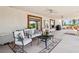 Spacious covered patio features stylish furniture, ceiling fans, and views of the outdoor landscape at 9111 W Stephen Ave, Las Vegas, NV 89149
