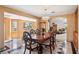 Dining room with large table and views of living areas and exterior at 9111 W Stephen Ave, Las Vegas, NV 89149