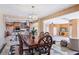 Open-concept dining area with a large table, chairs, and a view of the kitchen at 9111 W Stephen Ave, Las Vegas, NV 89149
