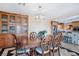 Elegant dining room featuring a large table, stylish chairs, and a decorative light fixture at 9111 W Stephen Ave, Las Vegas, NV 89149