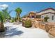 Expansive property with outdoor kitchen and stone accents, showcasing the luxurious outdoor living space at 9111 W Stephen Ave, Las Vegas, NV 89149