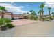 Home with a portico, circular driveway, desert landscaping, and a two-car garage at 9111 W Stephen Ave, Las Vegas, NV 89149