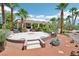 Beautiful front yard with desert landscaping, mature palm trees, and circular patio at 9111 W Stephen Ave, Las Vegas, NV 89149