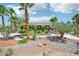 Expansive front yard with desert landscaping, palm trees, and a circular driveway at 9111 W Stephen Ave, Las Vegas, NV 89149