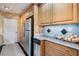 Functional kitchen offering granite countertops, stainless steel refrigerator, and wood cabinets at 9111 W Stephen Ave, Las Vegas, NV 89149