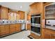 Gourmet kitchen with stainless steel appliances, custom cabinets, and decorative backsplash at 9111 W Stephen Ave, Las Vegas, NV 89149