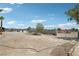 Large, empty lot offering many possibilities with mountains in the distance at 9111 W Stephen Ave, Las Vegas, NV 89149