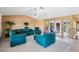 Inviting living room featuring neutral colors and access to outdoor areas at 9111 W Stephen Ave, Las Vegas, NV 89149