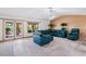 Bright living room with floor-to-ceiling windows and outdoor access at 9111 W Stephen Ave, Las Vegas, NV 89149