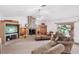 Spacious living area with vaulted ceilings and a rock fireplace at 9111 W Stephen Ave, Las Vegas, NV 89149