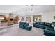Open living room with a rock fireplace and natural light at 9111 W Stephen Ave, Las Vegas, NV 89149