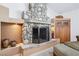 Living room showcasing a rock fireplace with earth-toned decor at 9111 W Stephen Ave, Las Vegas, NV 89149