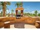 Outdoor built-in BBQ kitchen with stone surround is perfect for al fresco dining at 9111 W Stephen Ave, Las Vegas, NV 89149