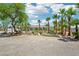 Expansive outdoor area with lush greenery, palm trees, and desert landscaping, perfect for relaxation and enjoyment at 9111 W Stephen Ave, Las Vegas, NV 89149