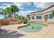 Backyard swimming pool with lush landscaping, rock features and tanning ledge, perfect for outdoor entertaining at 9111 W Stephen Ave, Las Vegas, NV 89149