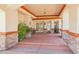 Elegant portico featuring stone accents, covered seating area, and ornate double doors at 9111 W Stephen Ave, Las Vegas, NV 89149