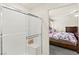 Bathroom features a shower with glass doors and a built-in seat with bedroom view at 9161 Rolling Sky Dr, Las Vegas, NV 89178