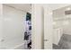 Bathroom featuring shower and white tiled walls at 9161 Rolling Sky Dr, Las Vegas, NV 89178