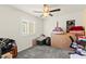 Bedroom with carpet, window, closet, and ceiling fan at 9161 Rolling Sky Dr, Las Vegas, NV 89178