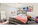 This bedroom features a decorative headboard and a large window at 9161 Rolling Sky Dr, Las Vegas, NV 89178