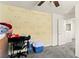 Bedroom with carpet, ceiling fan, and light yellow wall with bunny decals at 9161 Rolling Sky Dr, Las Vegas, NV 89178