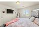 This bedroom features a large window and decorative headboard at 9161 Rolling Sky Dr, Las Vegas, NV 89178