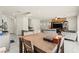 Open-concept layout showcasing dining area, kitchen island, and living room for entertaining at 9161 Rolling Sky Dr, Las Vegas, NV 89178