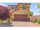 Charming two-story home with a two car garage and low maintenance landscaping at 9161 Rolling Sky Dr, Las Vegas, NV 89178
