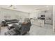 Open-concept living space with modern finishes, stainless steel appliances, and lots of light at 9161 Rolling Sky Dr, Las Vegas, NV 89178