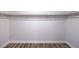 Walk-in closet featuring laminate floors and a closet rod at 9321 Dancing Daffodil Ave, Las Vegas, NV 89129