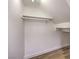 Walk-in closet with neutral walls, wood-look floors, and a clothes rod for organization at 9321 Dancing Daffodil Ave, Las Vegas, NV 89129