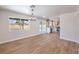 Bright dining area with backyard views and modern lighting flows to the updated kitchen at 9321 Dancing Daffodil Ave, Las Vegas, NV 89129