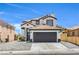 Two story home featuring a tile roof, dark trim, and desert landscaping at 9321 Dancing Daffodil Ave, Las Vegas, NV 89129